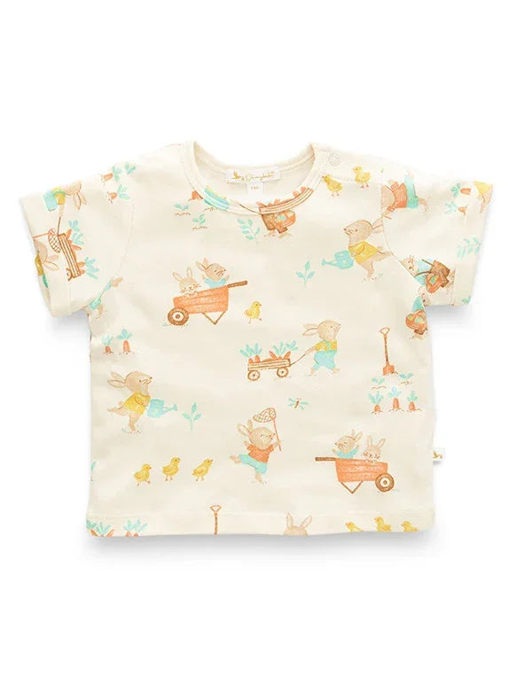 Baby shirt with colorful cartoon designs on a white background