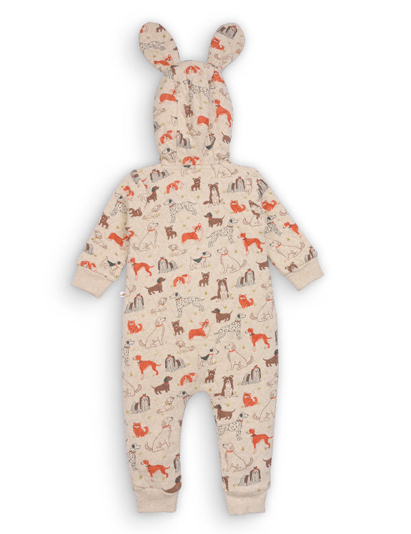 Back view of beige quilted baby romper with colorful dog prints and hood with bunny ears