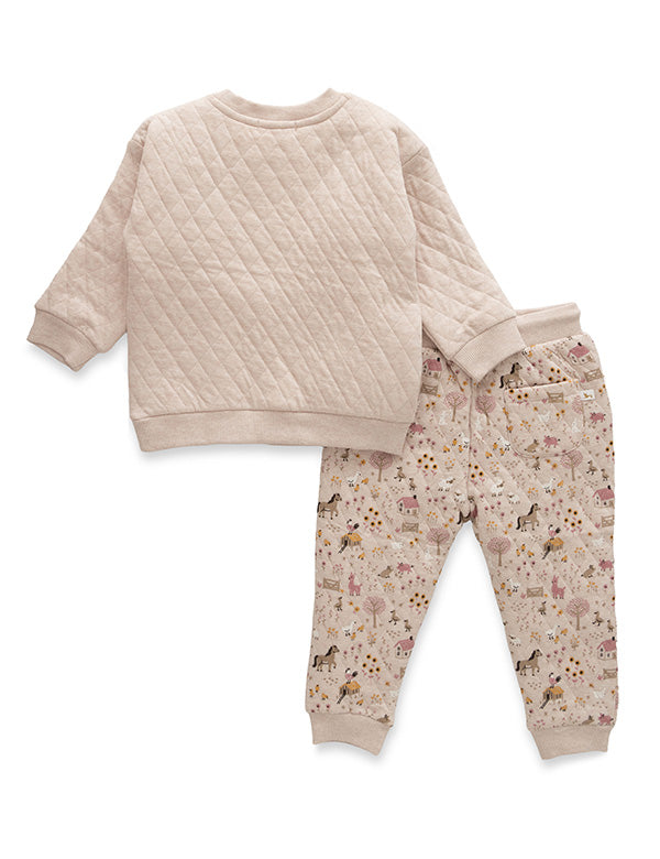 Back view of organic cotton baby winter wear set featuring beige quilted sweatshirt and farm-print joggers