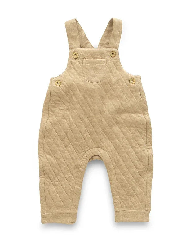 Beige quilted baby overalls on a white background