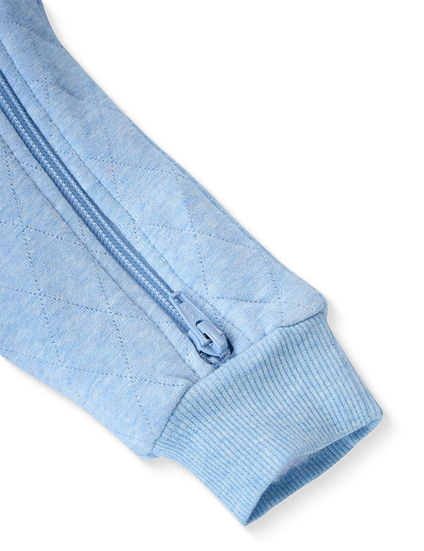 Close-up of blue baby romper sleeve with ribbed cuff and two-way zipper.