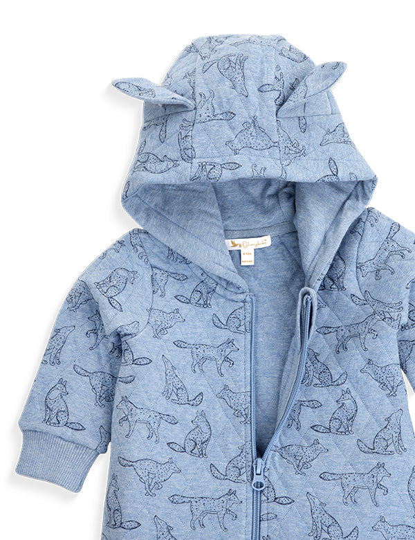 Close-up of blue quilted baby romper with fox print and hood featuring cute ears