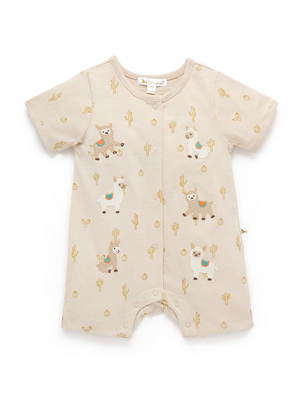 Front view of beige baby romper featuring llama embroidery, cactus pattern, and snap buttons for easy changing.