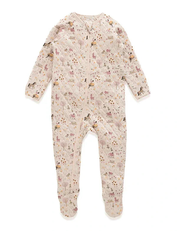 Beige quilted baby romper with farm animal and tree print, full zip front, long sleeves, and footed legs