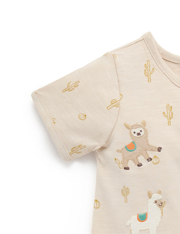 Beige baby romper with embroidered llama and cactus patterns, short sleeve infant clothing