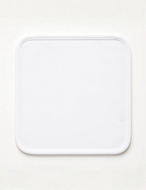 White square plate with rounded corners on a plain light background