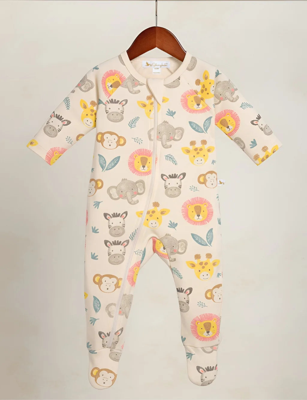 Baby onesie with animal pattern on a hanger against a white background