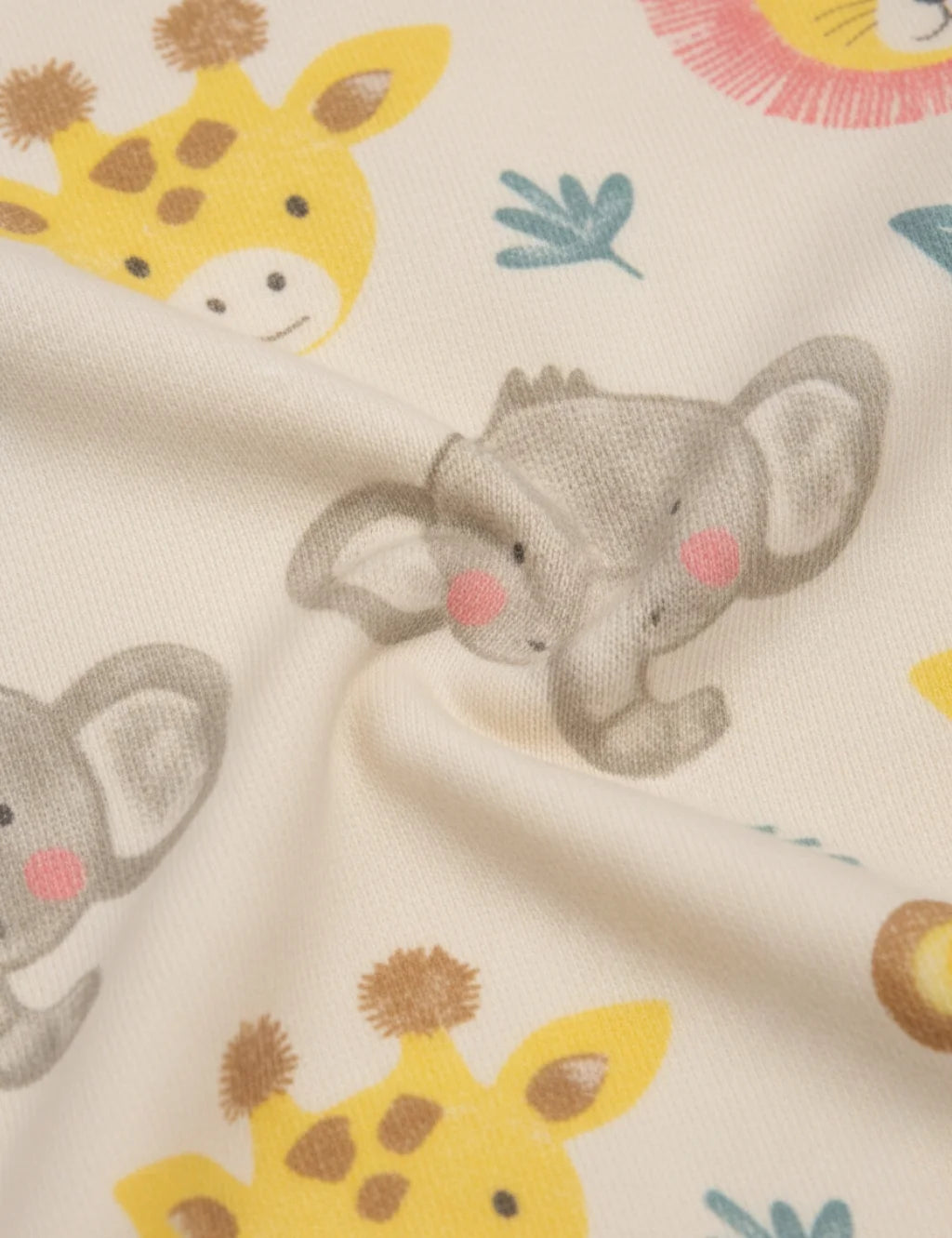 Fabric with cartoon elephants and giraffes on a beige background