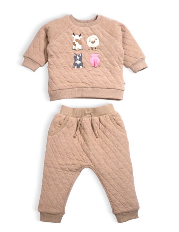 Quilted beige sweatshirt and pants set with animal prints on a white background
