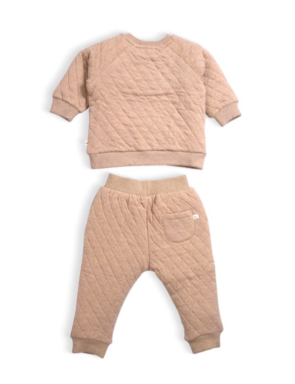 Quilted beige baby outfit with matching top and pants on a white background