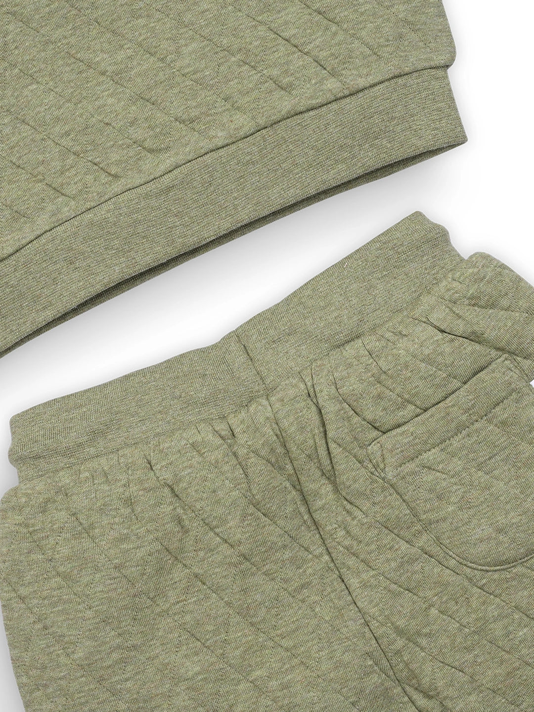 Green quilted jacket on a white background