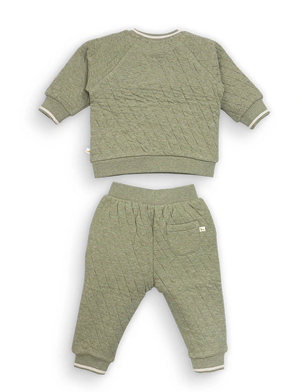 Green quilted sweatshirt and pants set on a white background