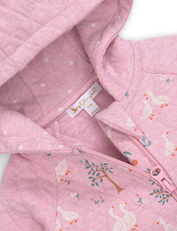 Pink quilted baby hoodie with white duck and tree prints, zipper closure, and polka dot inner lining