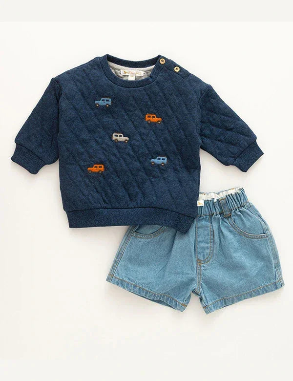 Toddler boy outfit with navy quilted sweatshirt featuring colorful car appliques and light denim shorts