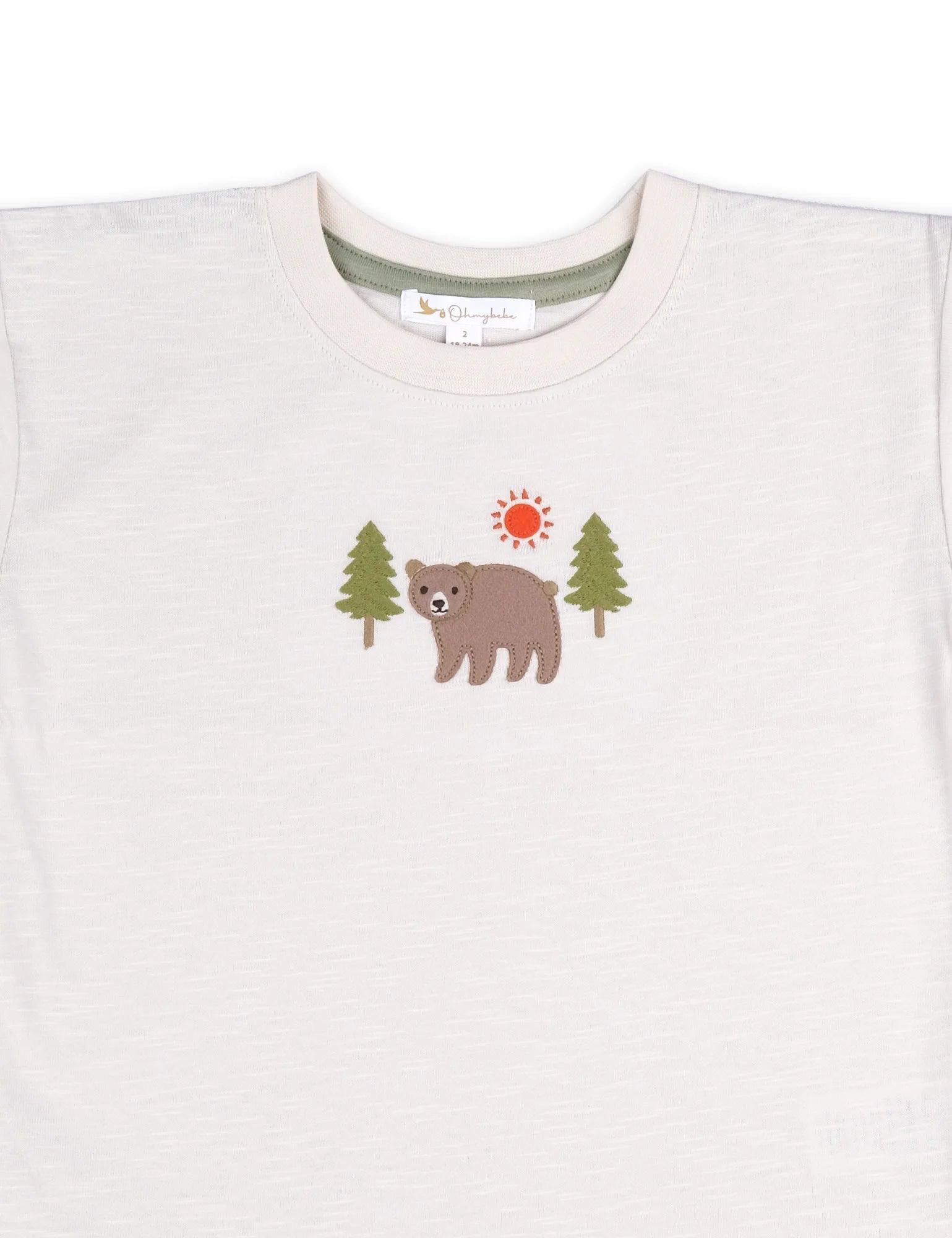 Organic cotton baby t-shirt with bear applique and green trees under red sun