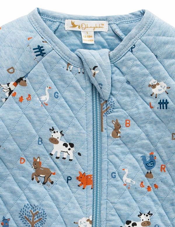 Blue quilted baby romper with farm animal prints including cow, horse, pig, and sheep, zip closure