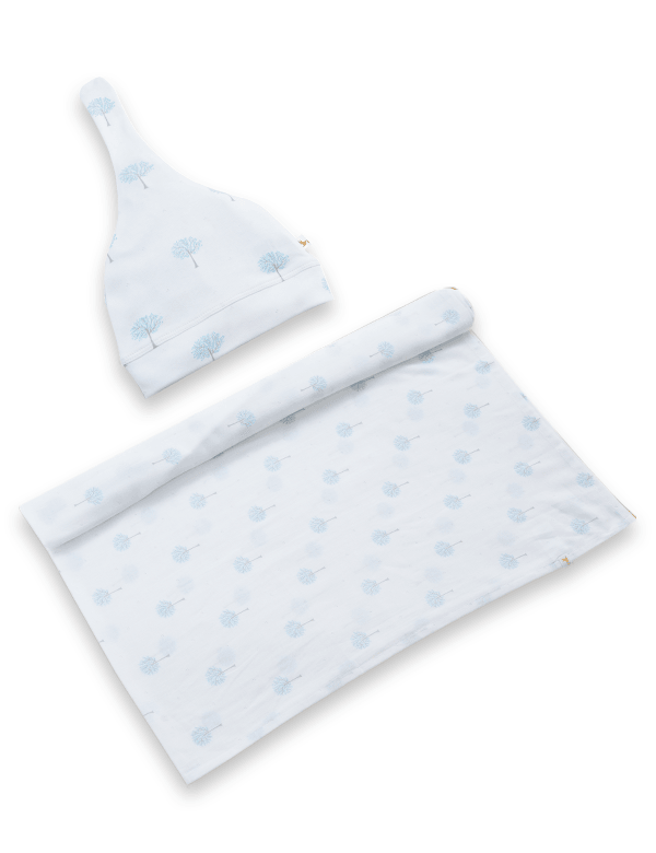 White baby wrap and cap set with light blue tree print on a white background