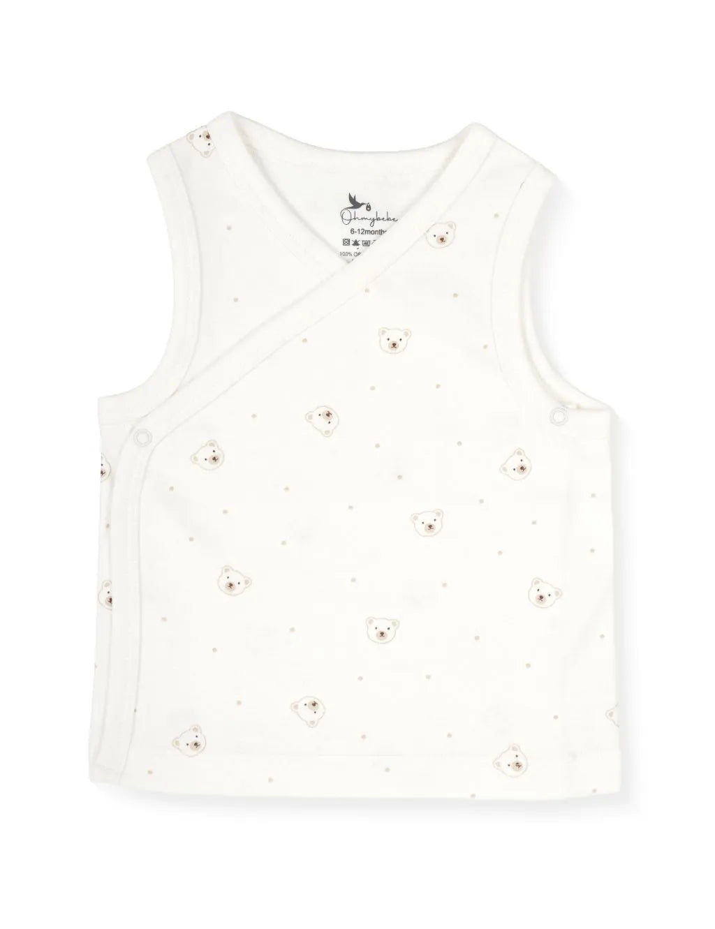 A sleeveless cream-colored baby wrap-style tank top featuring a delicate scattered pattern of tiny light brown dots and small teddy bear faces. The top is styled with tonal cream trim along the neckline and crossover edges, featuring side snap-button closures, laid flat against a plain white background.