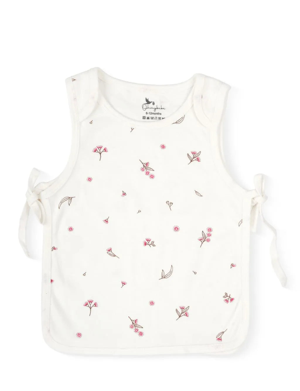 A sleeveless cream-colored baby tank top featuring a delicate scattered pattern of small pink flowers and tiny green leaves. The top is finished with tonal stitched trim along the edges and adjustable side-tie closures on both sides, laid flat against a plain white background.