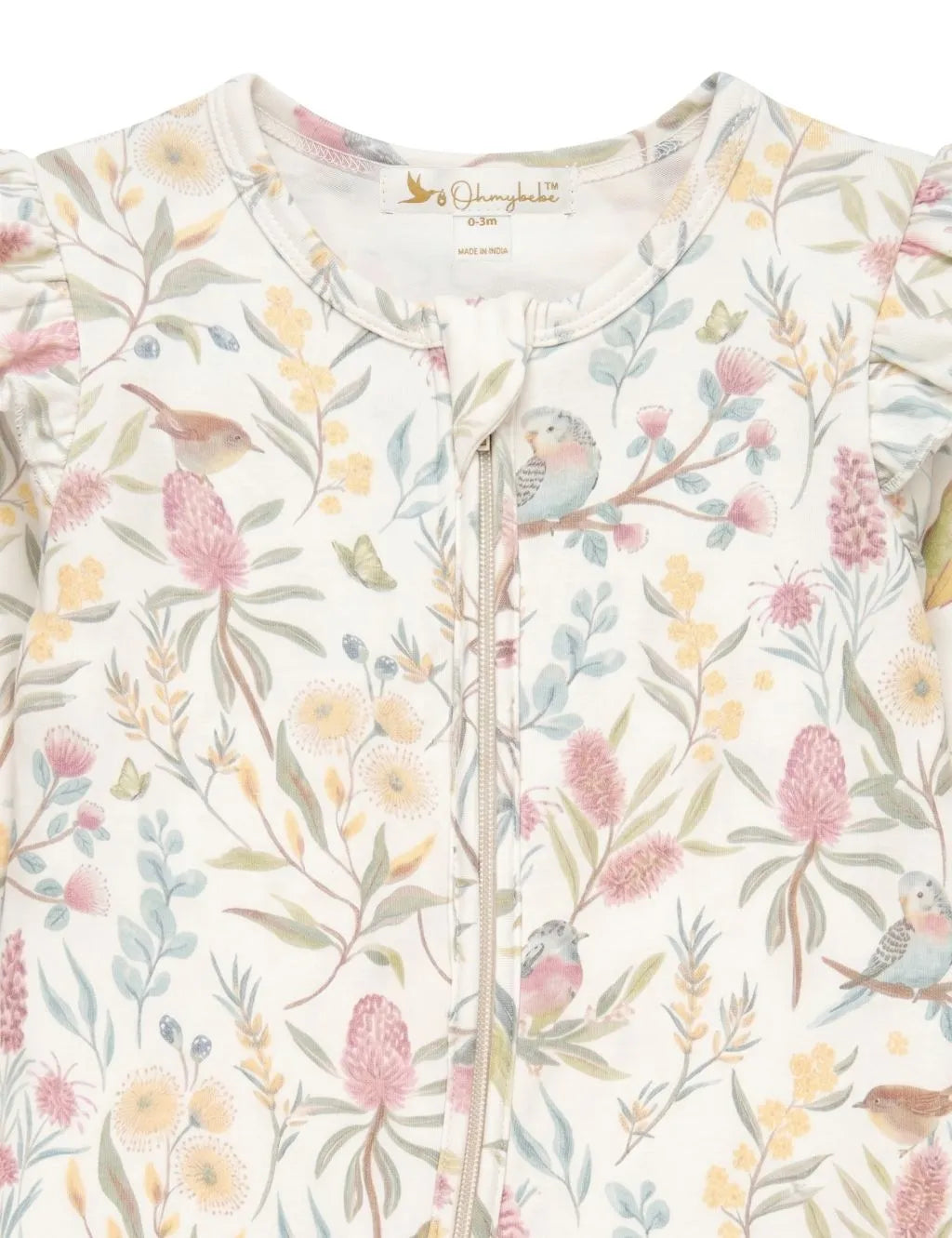 Close-up view of botanical floral and bird print baby romper highlighting the zip-up neckline and ruffle trim