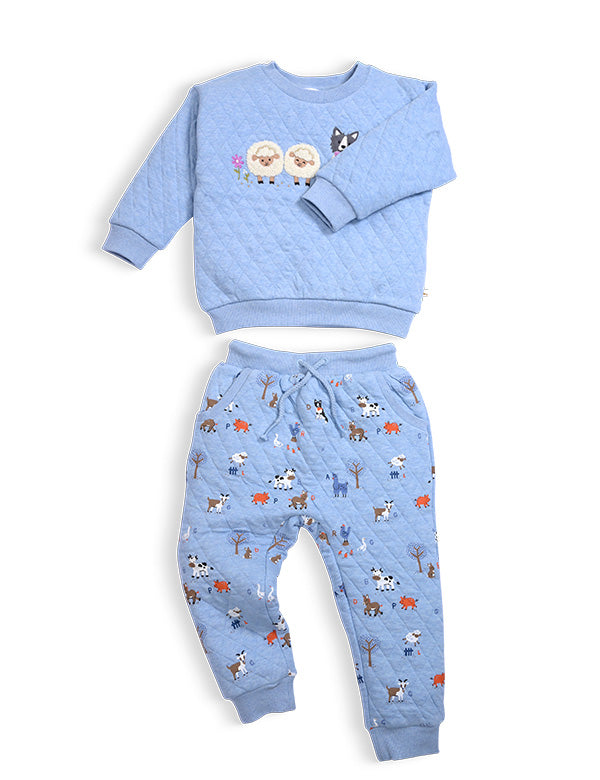 Light blue quilted toddler outfit with sheep and dog embroidery on sweatshirt and farm animal print pants