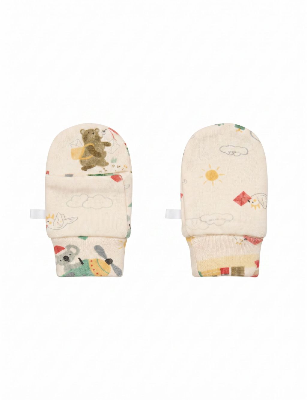 A pair of cream-colored baby scratch mittens featuring a whimsical holiday print with a bear delivering mail, a koala flying an airplane, clouds, and a sun, laid flat against a white background.