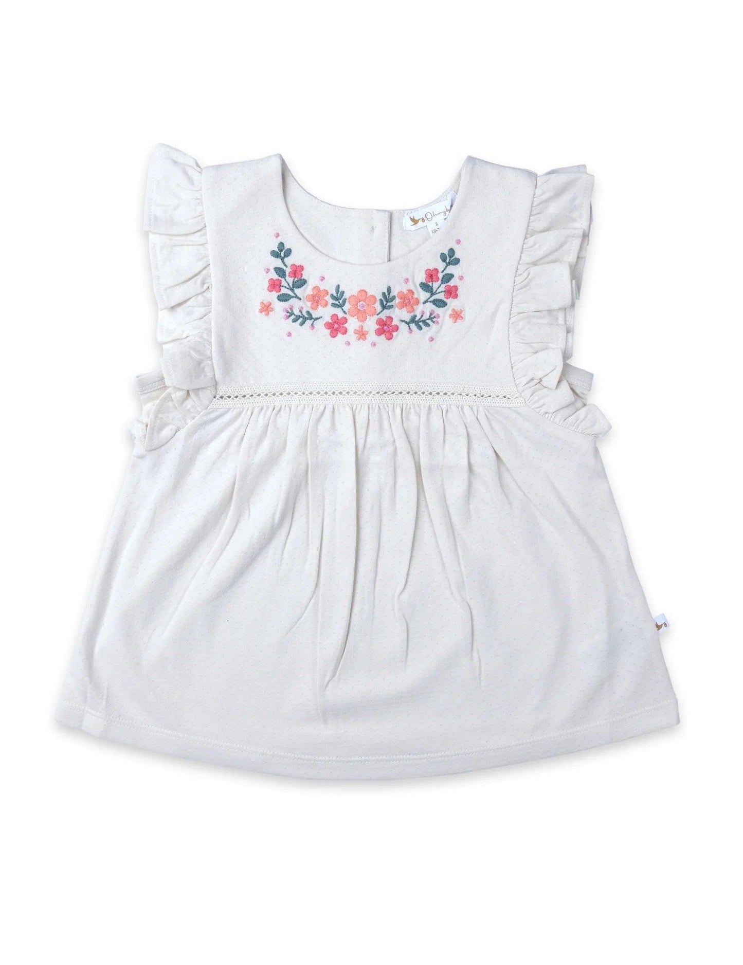 White baby ruffle tunic top with pink and orange floral embroidery on chest