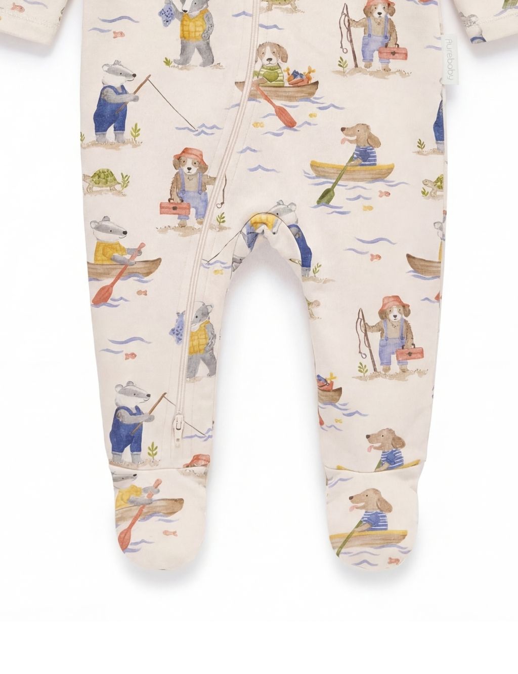Close-up of the footed legs on an organic cotton baby zipper romper with fisherman prints.