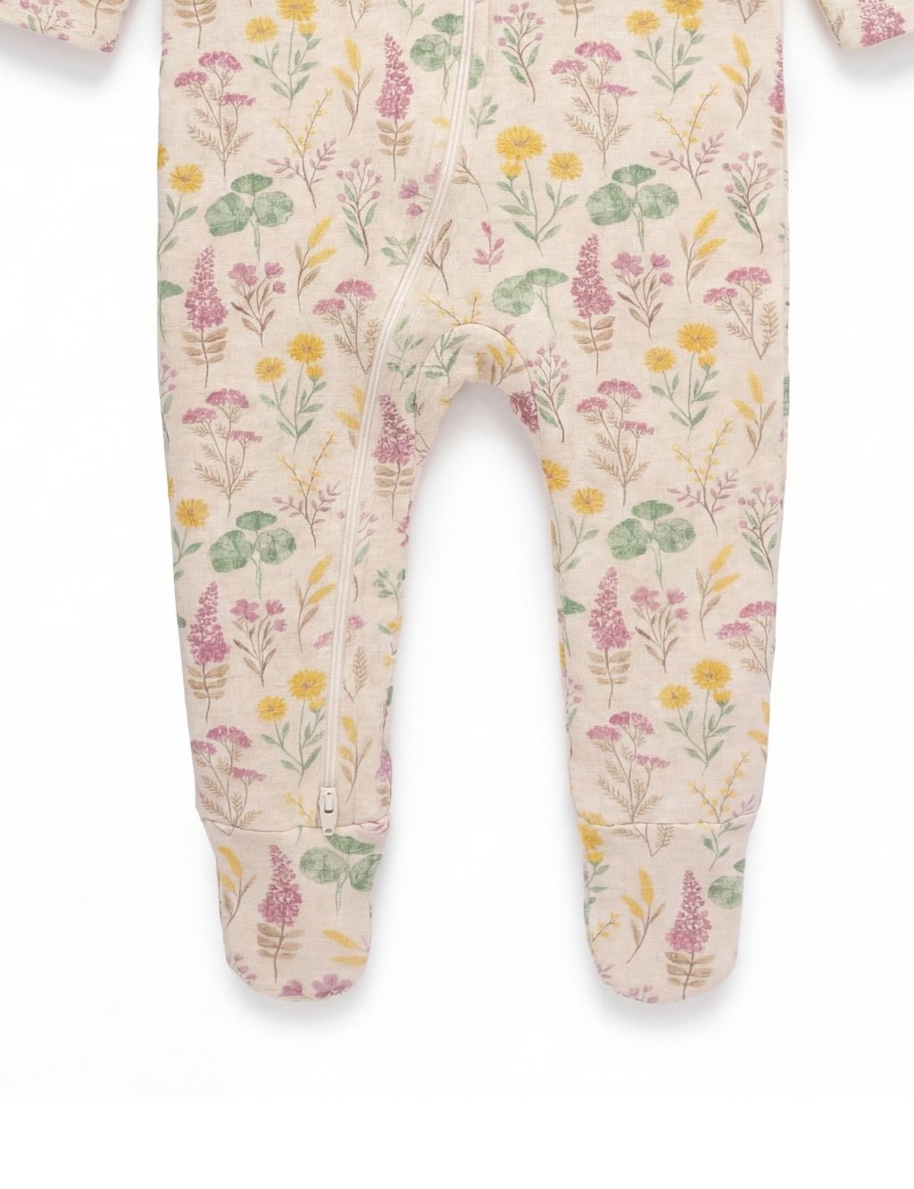 Close-up of the footed legs on an organic cotton baby zipper romper with lilypad print.