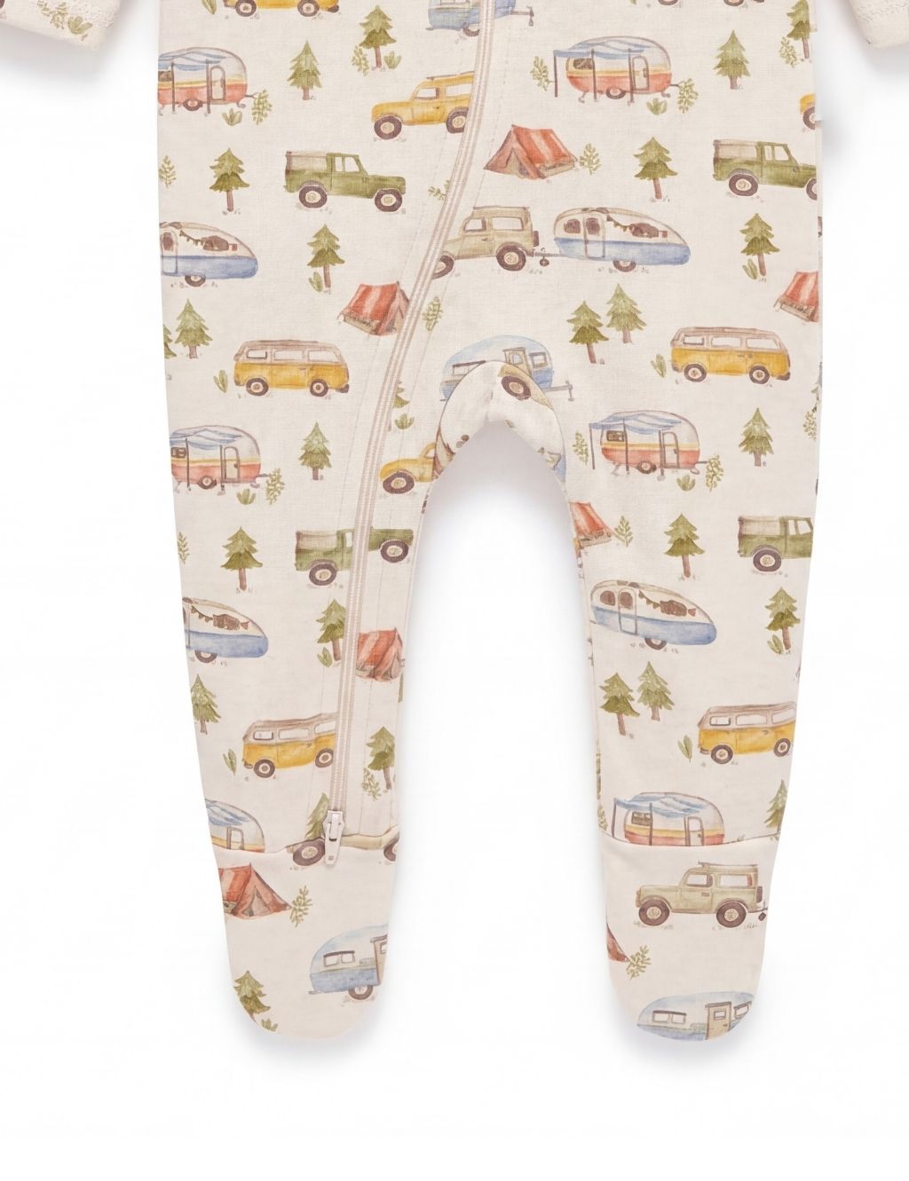 Close-up of the footed legs on a cream organic cotton baby zipper romper featuring a fun camping adventure print.