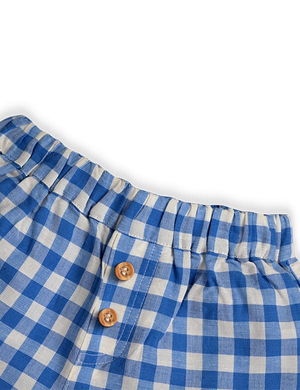 Blue and white gingham baby shorts with elastic waistband and two brown buttons