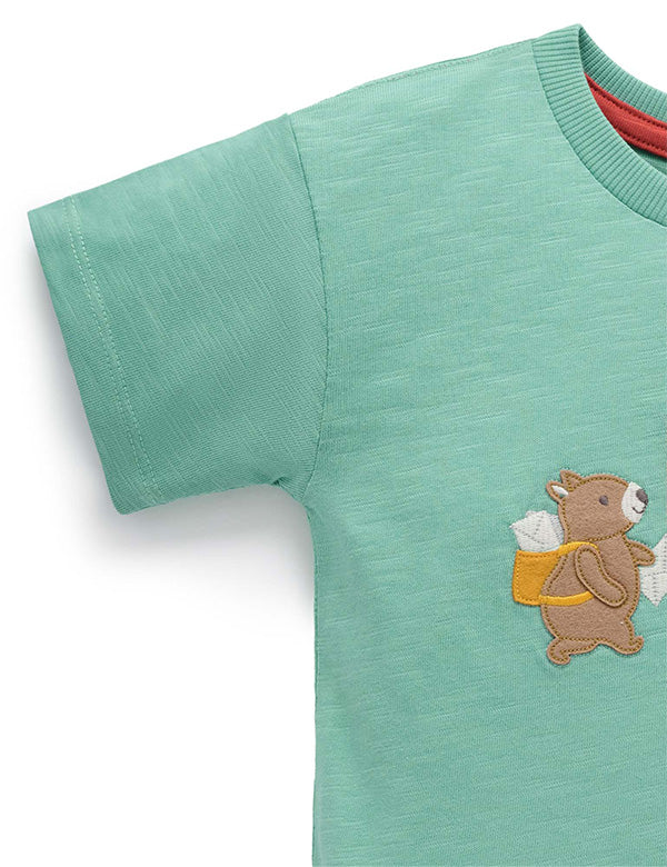Green t-shirt with a bear design on a white background