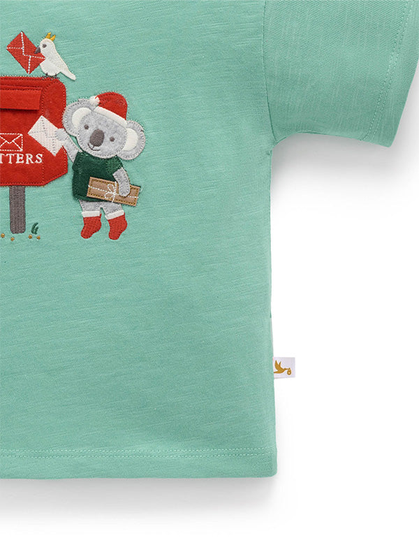 Green t-shirt with a cartoon koala holding a letterbox and letters on a white background