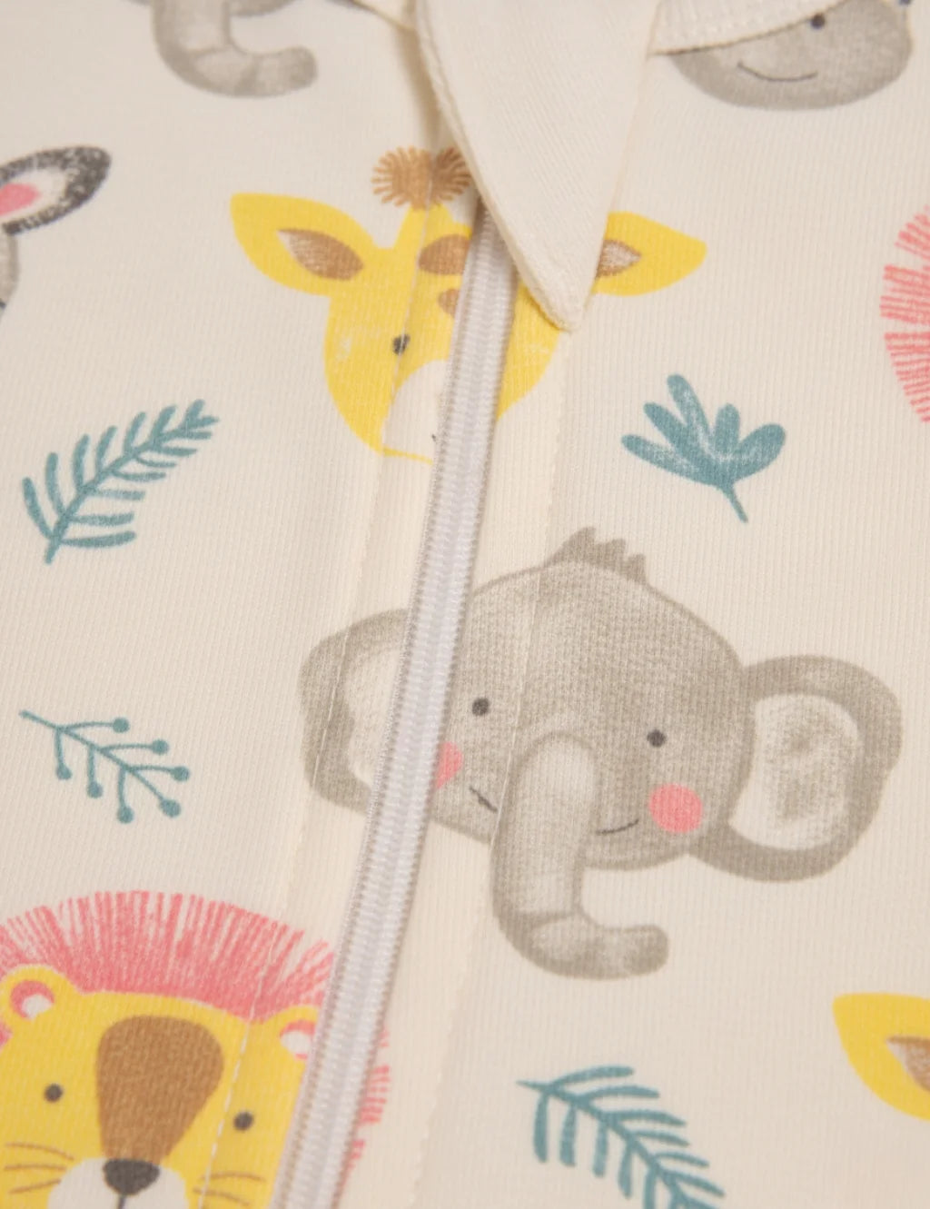 Children's garment with animal prints and a zipper on a light background