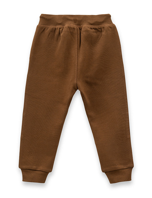 Back view of brown baby joggers with ribbed cuffs and elastic waistband on white background