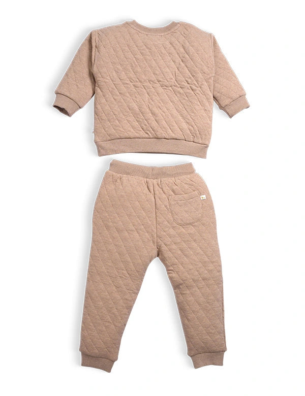 Quilted beige sweatshirt and pants set on a white background