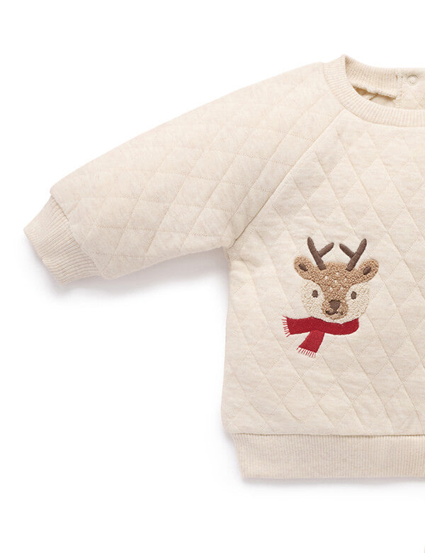 Children's quilted sweater with reindeer design on a white background