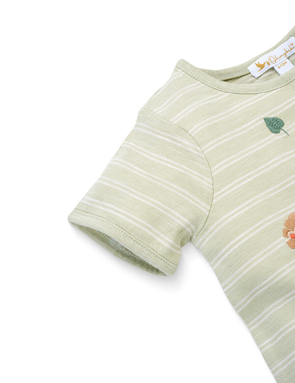 Close-up of light green striped baby onesie with embroidered flowers and leaves detail