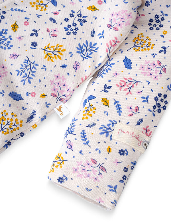 Floral patterned fabric with 'Mia & Co' branding on a white background