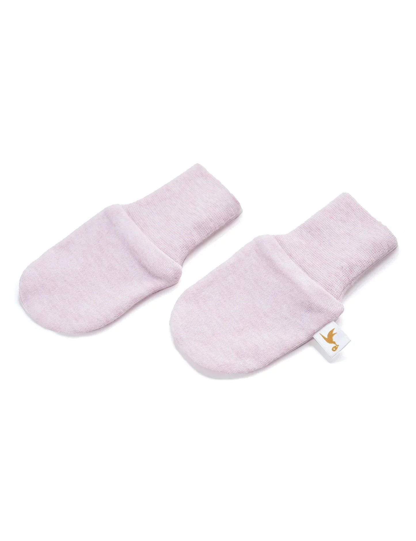 Pair of pale pink baby mittens with soft fabric and folded cuffs on white background