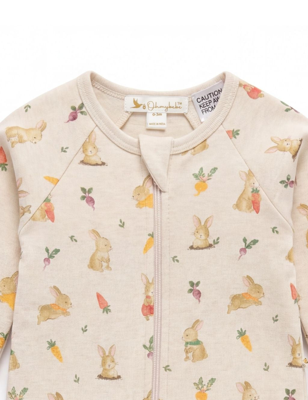 Close-up of the neckline and covered zipper on a beige bunny print baby romper.