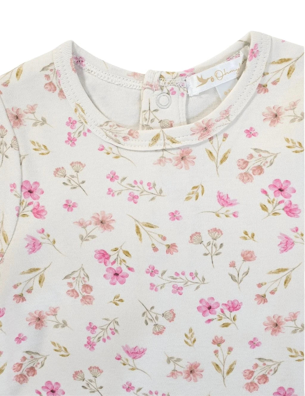Close-up of the round neckline and fabric detail on a white organic cotton baby growsuit with a pink floral print.