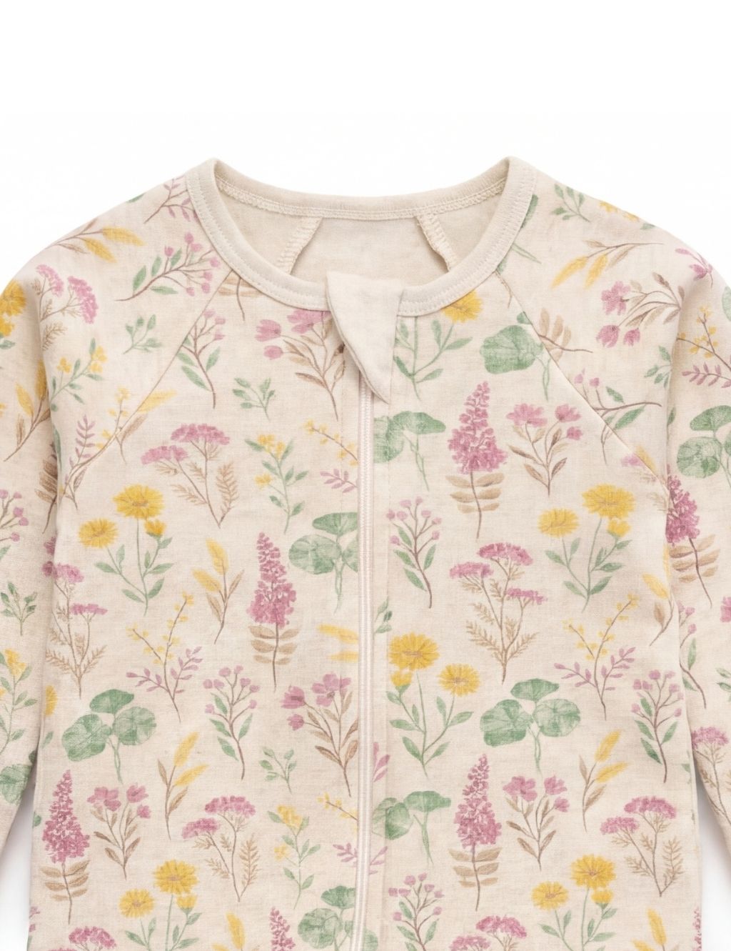 Close-up of the neckline and covered zipper on an organic cotton lilypad baby romper.