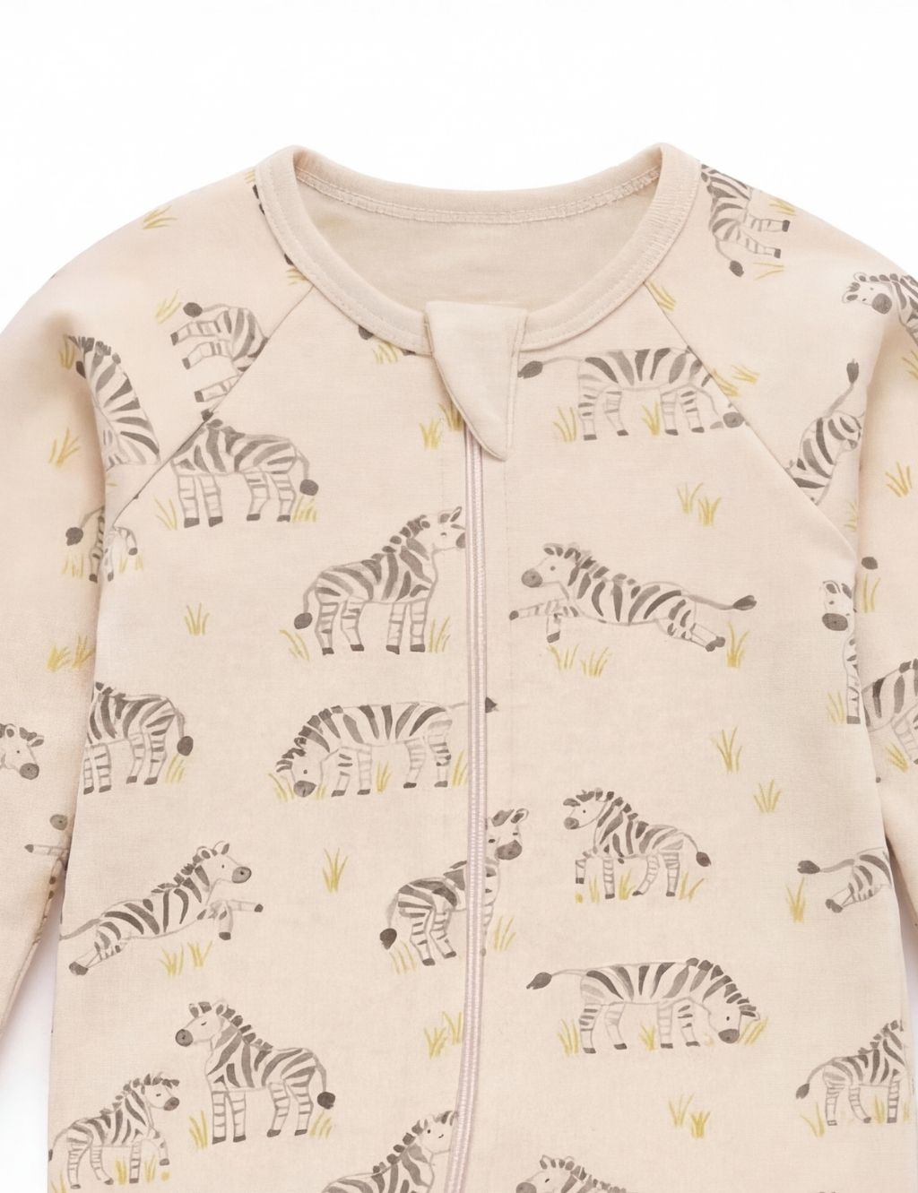 Close-up of the neckline and covered zipper tab on a cream organic cotton grazing zebra baby romper.