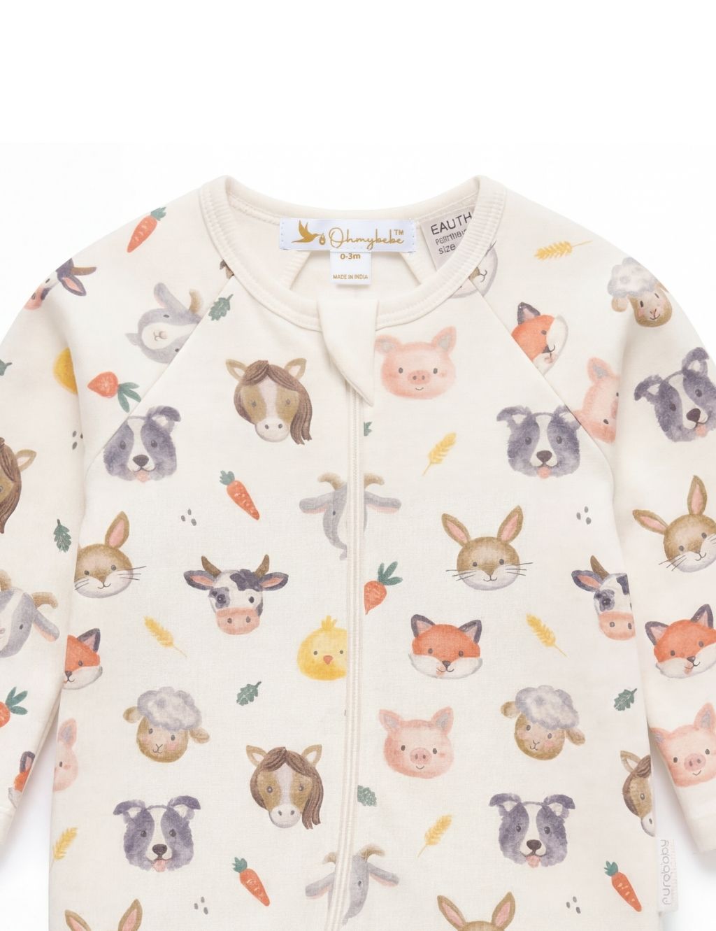 Close-up of the neckline and zipper on a farm animal print organic baby romper.