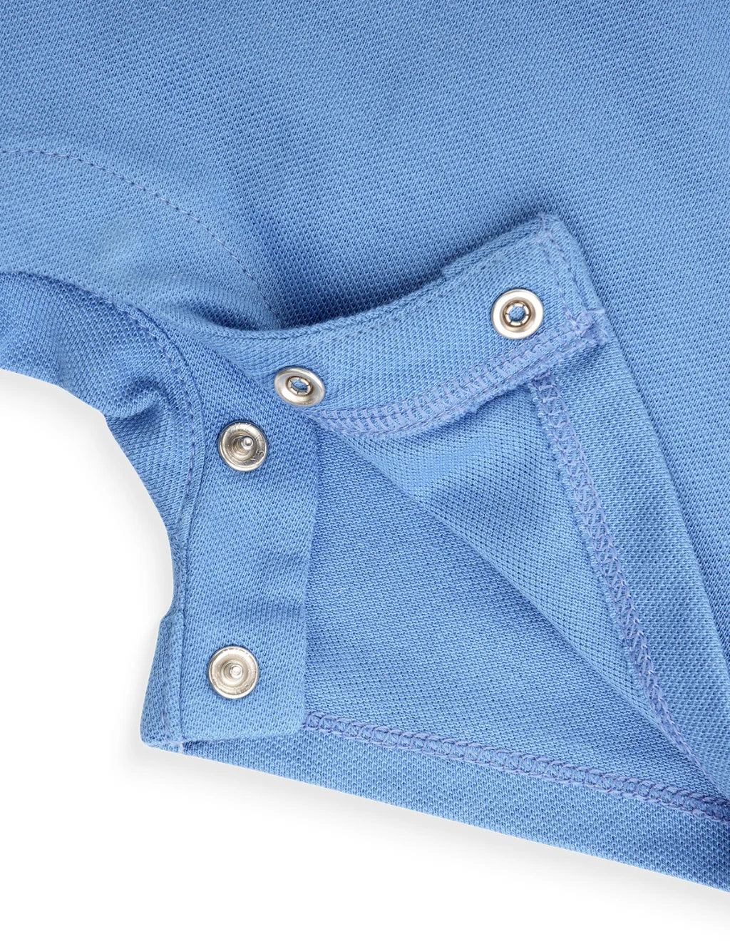 Close-up of a blue polo shirt with button details on a white background