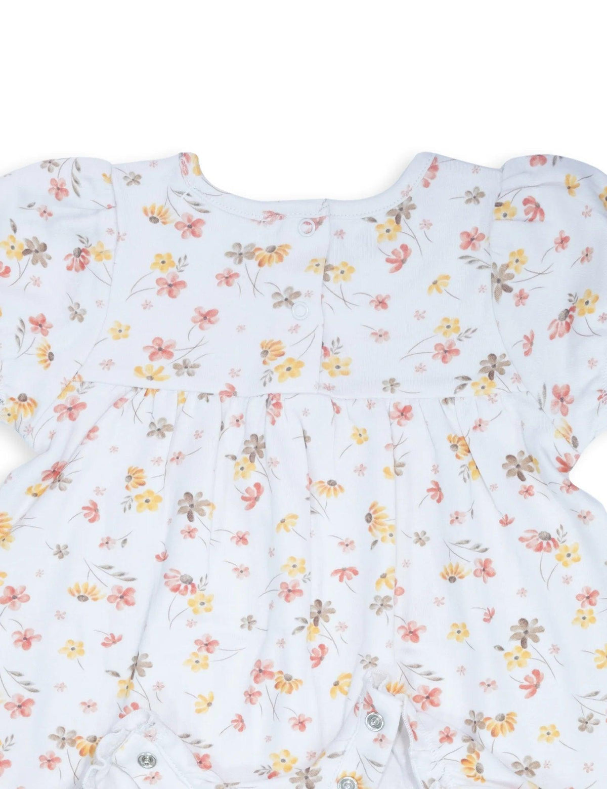 White baby romper with yellow, pink, and brown floral print and back snap buttons