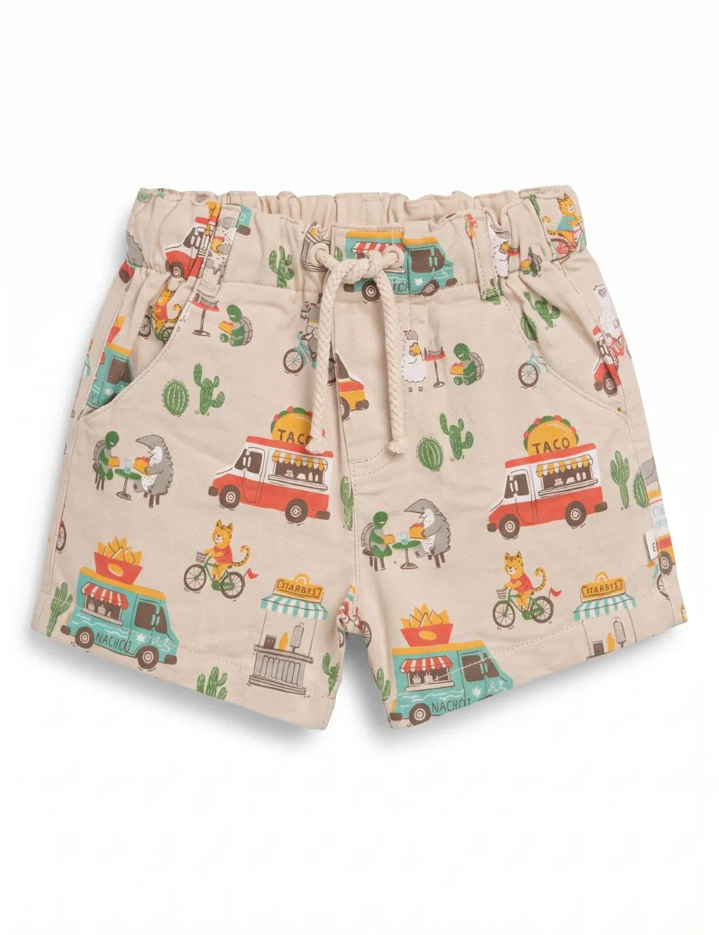 Flatlay of organic cotton printed shorts featuring a taco food truck motif, pockets, and an adjustable drawstring waistband.