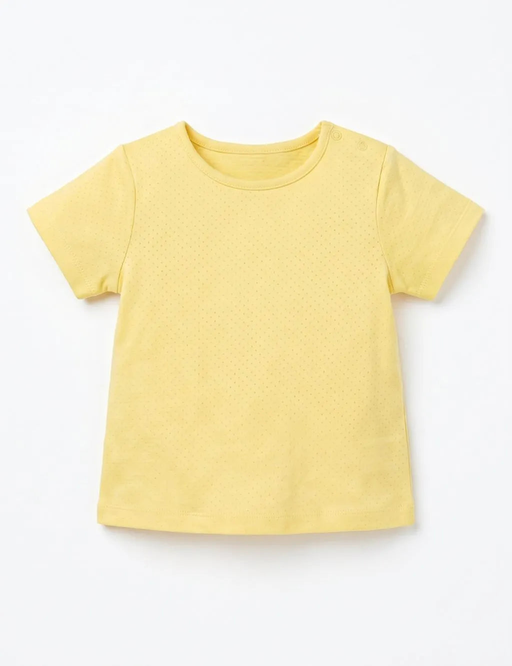 Flatlay of a plain yellow organic cotton short-sleeve t-shirt with shoulder snaps against a white background