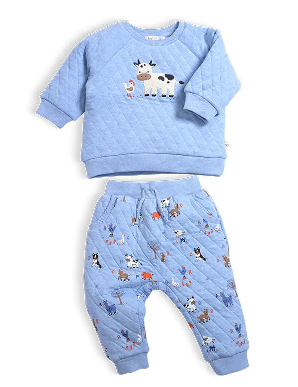 Warm blue organic cotton quilted baby winter clothes set with animal embroidery top and printed joggers — front view.